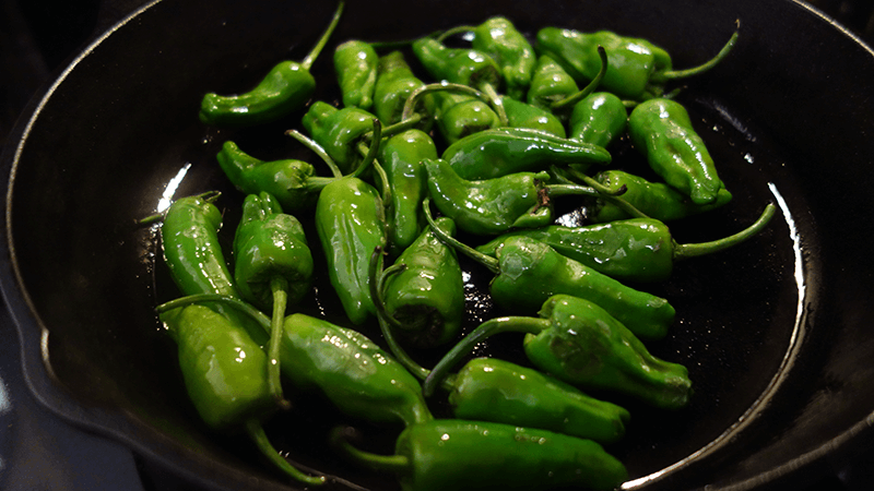 padrones cooking in cast iron