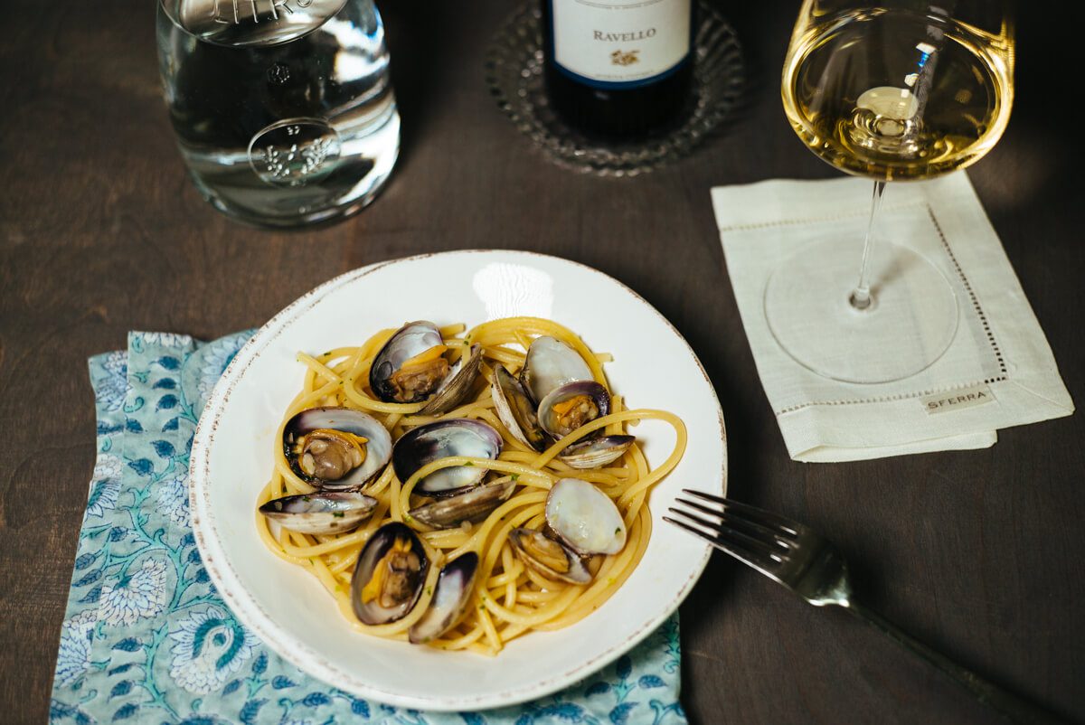 Pasta with clams are paired with Marisa Cuomo Ravello Bianco wine