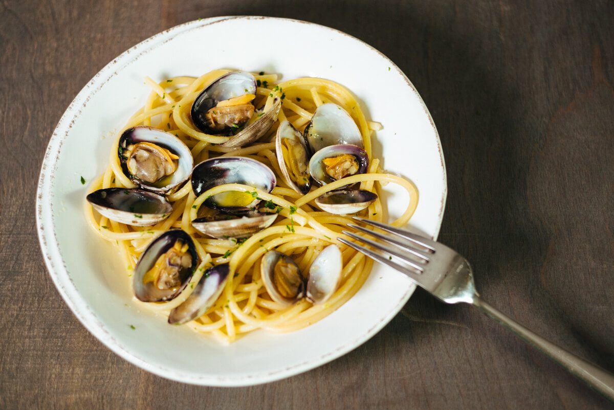 Pasta with clams are served in a Vieri bowl to guests as a simple dinner