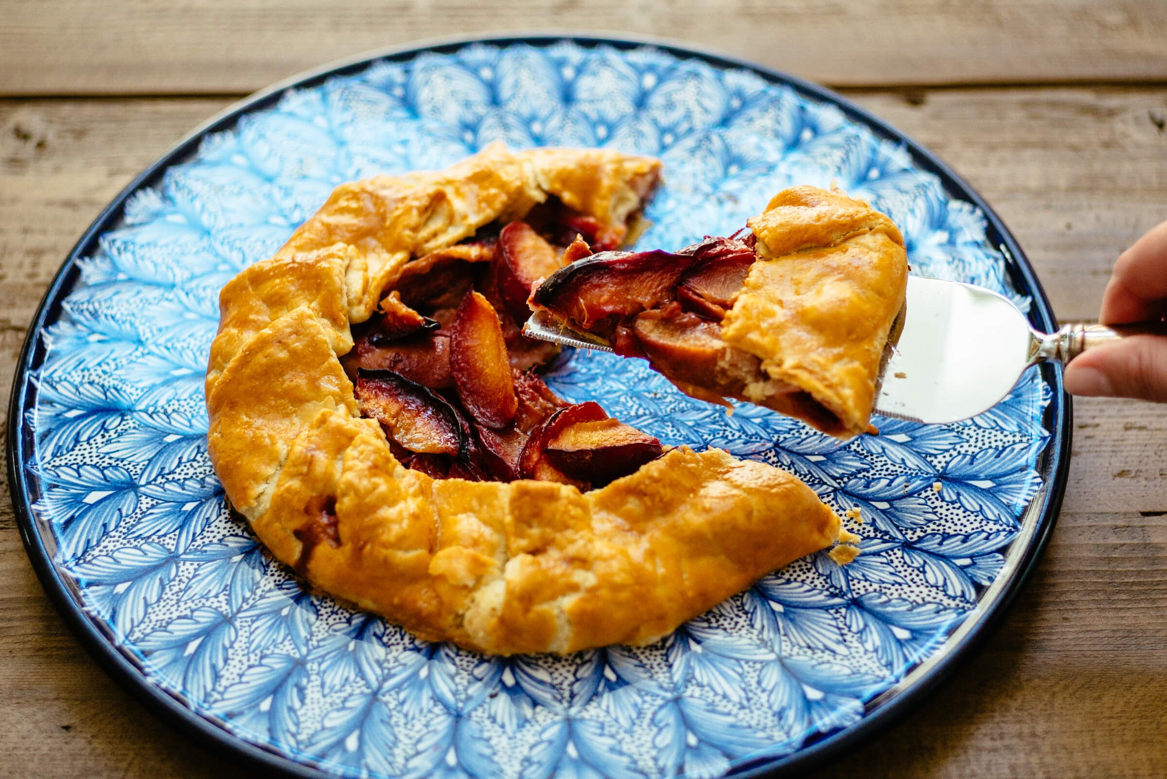 The Taste Edit slices their rustic Plum stone fruit galette 