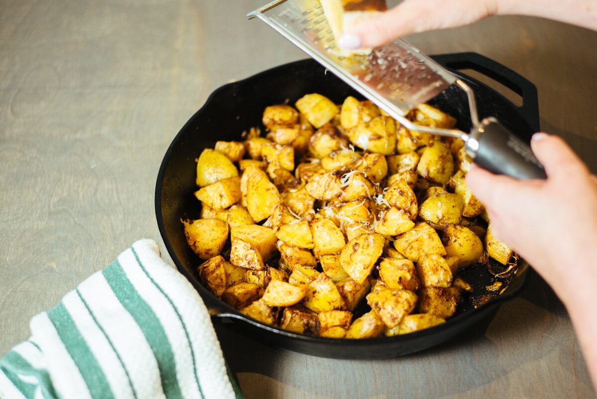 Grating cheese with a microplane for cast iron skillet manchego cheese potatoes