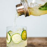 line the glass with cucumbers and fill with ice for a beautiful cocktail presentation of the cucumber rickey cocktail recipe