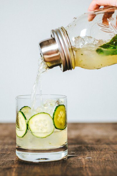 line the glass with cucumbers and fill with ice for a beautiful cocktail presentation of the cucumber rickey cocktail recipe