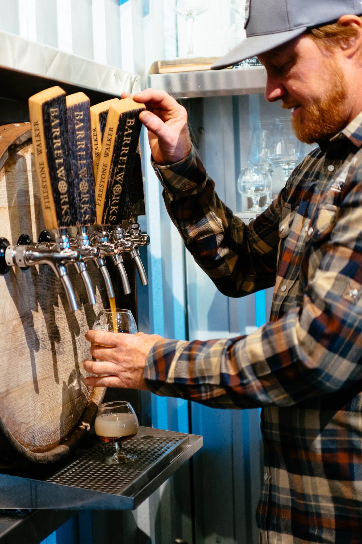 Master Blender Jim Crooks pouring sour beer at firestone walker barrel works
