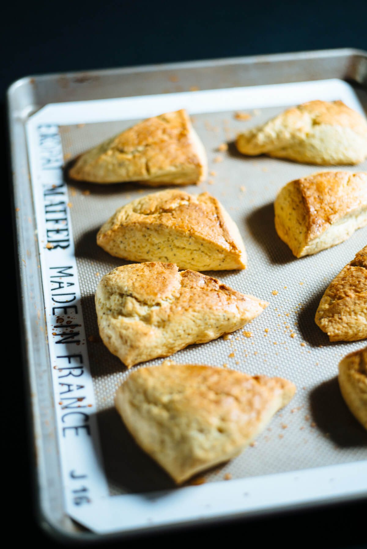 The Taste Edit baking lemon poppyseed scones.
