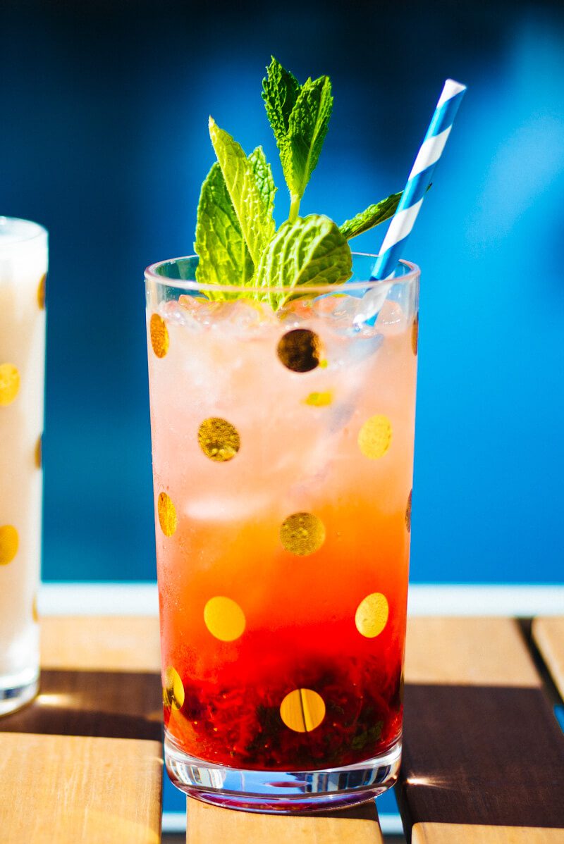Refreshing strawberry mojito served poolside in Kate Spade glasses by The Taste Edit.