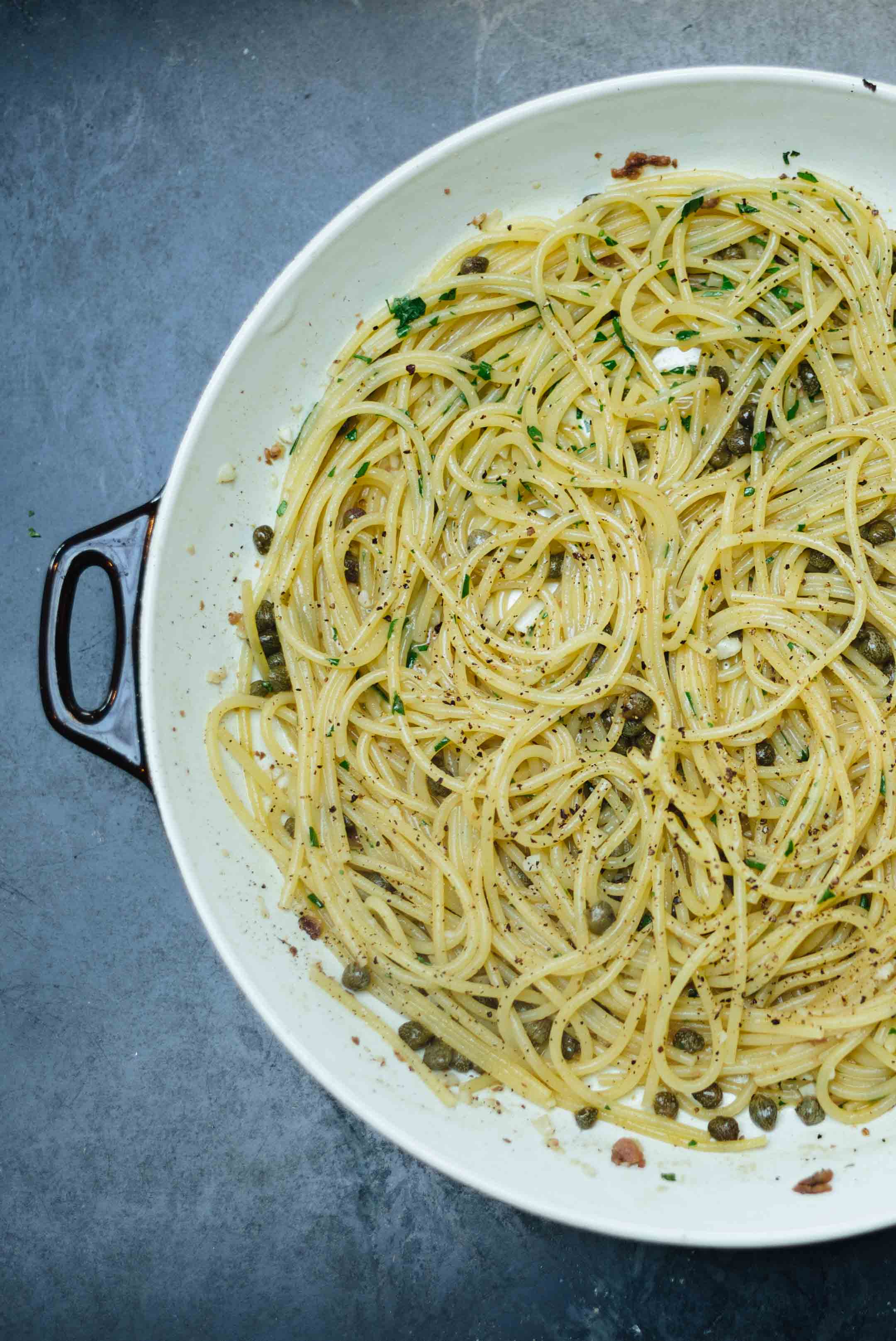 Try this recipe for spaghetti with anchovies and capers, made with French butter, and garlic. | thetasteedit.com #recipe #pasta #easy