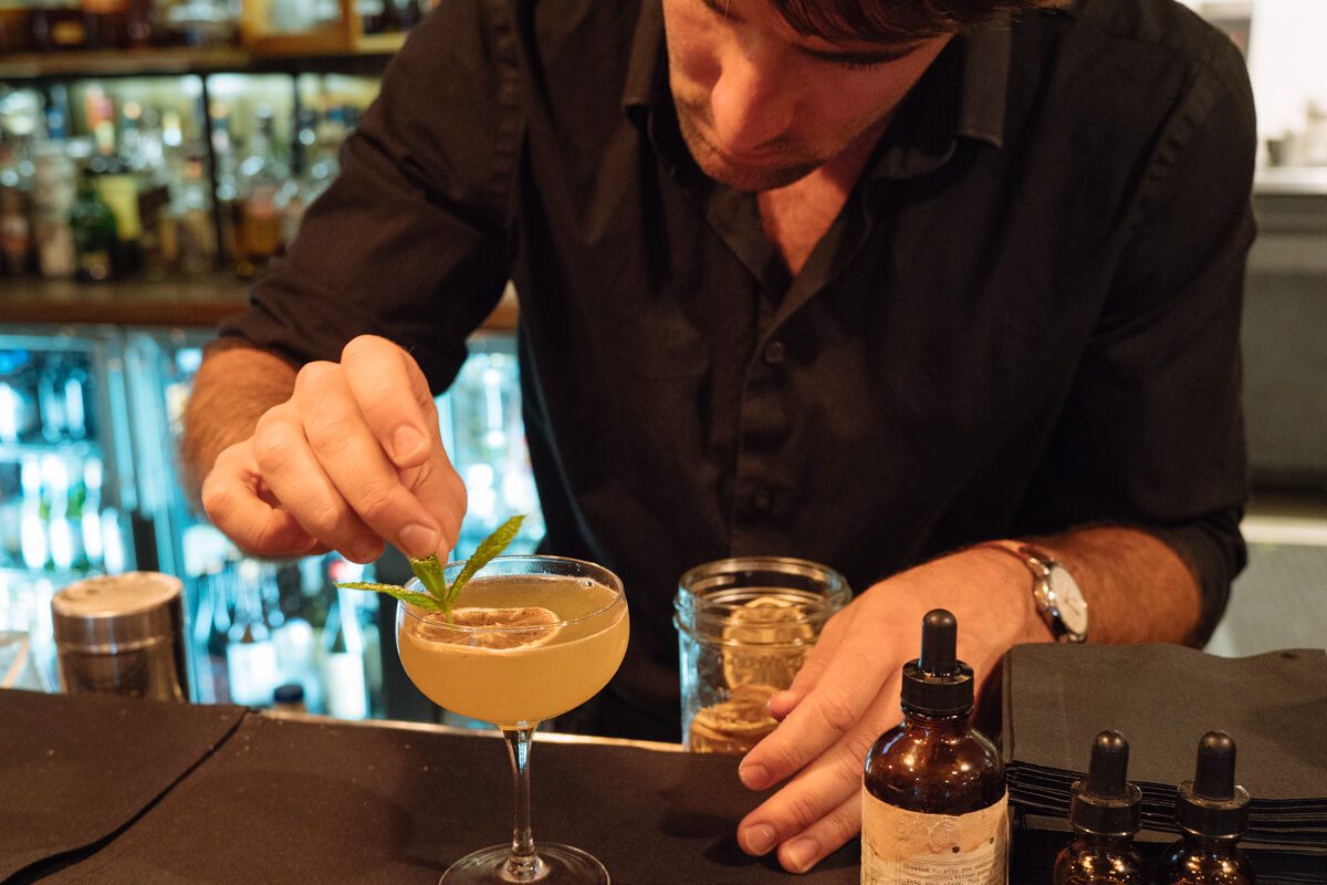 Completing a cocktail at SY Kitchen