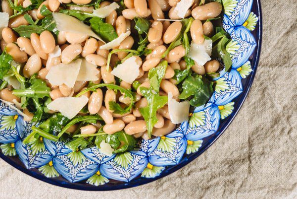 The Taste Edit serves their recipe for white bean salad, arugula, and grana padano