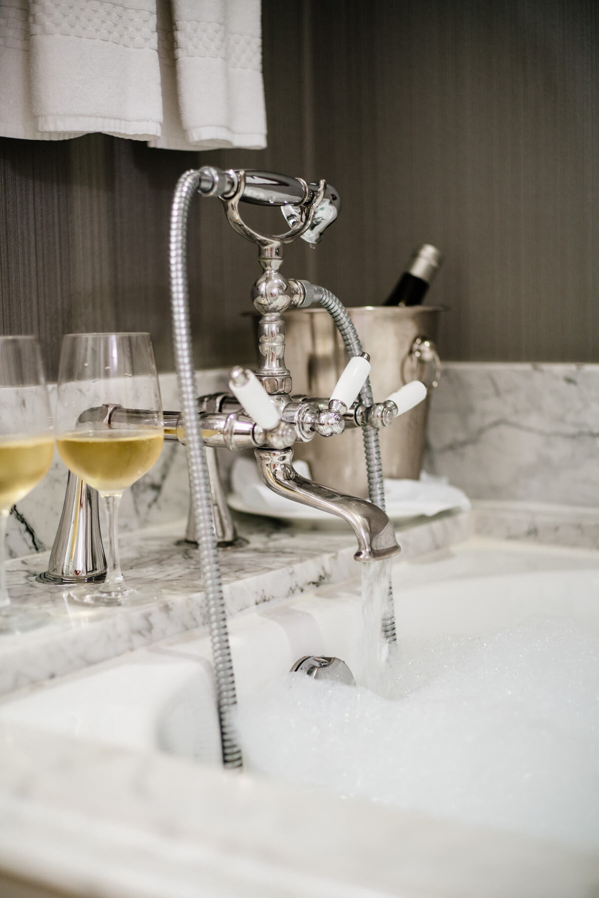 Beautiful bathroom and white wine at The Ritz-Carlton Half Moon Bay