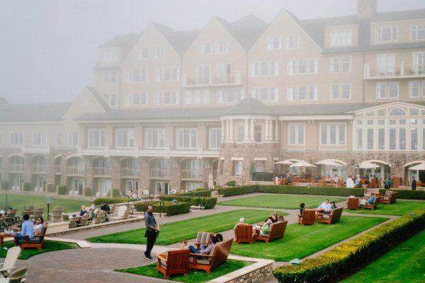 The ritz-carlton half moon bay set up on the cliffs with a beach below.