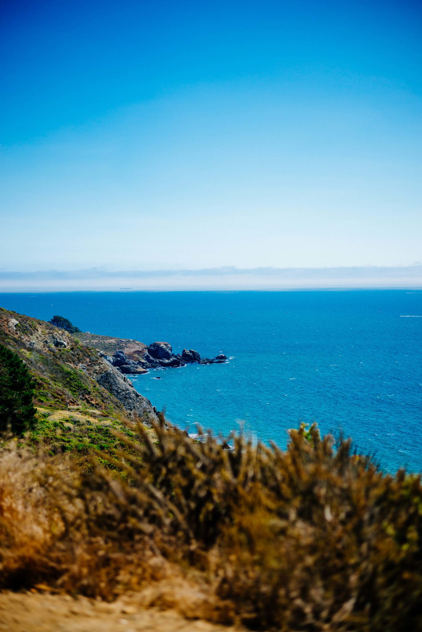 Driving down Highway 1 overlooking the pacific ocean