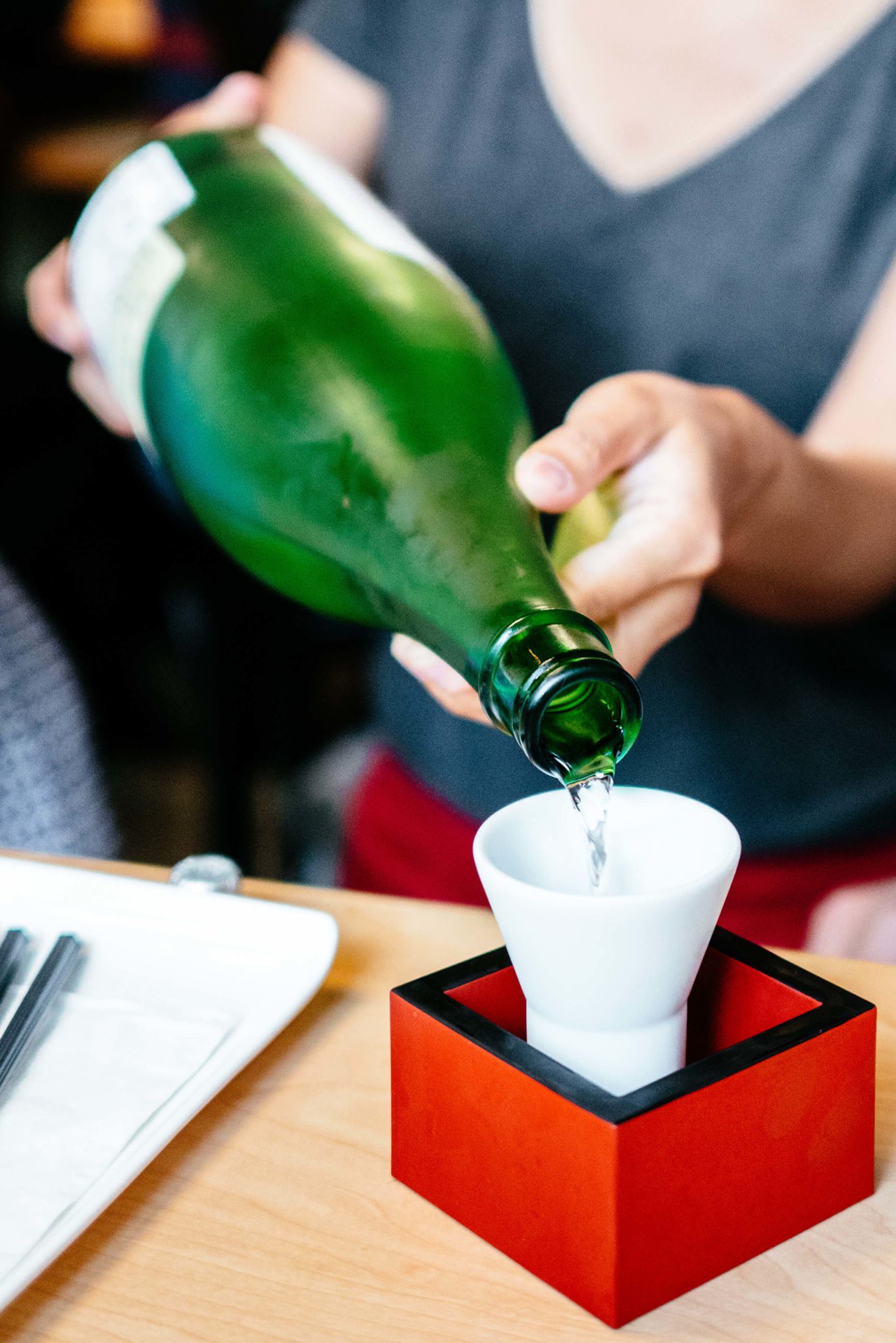 pouring sake at Mensho Tokyo SF