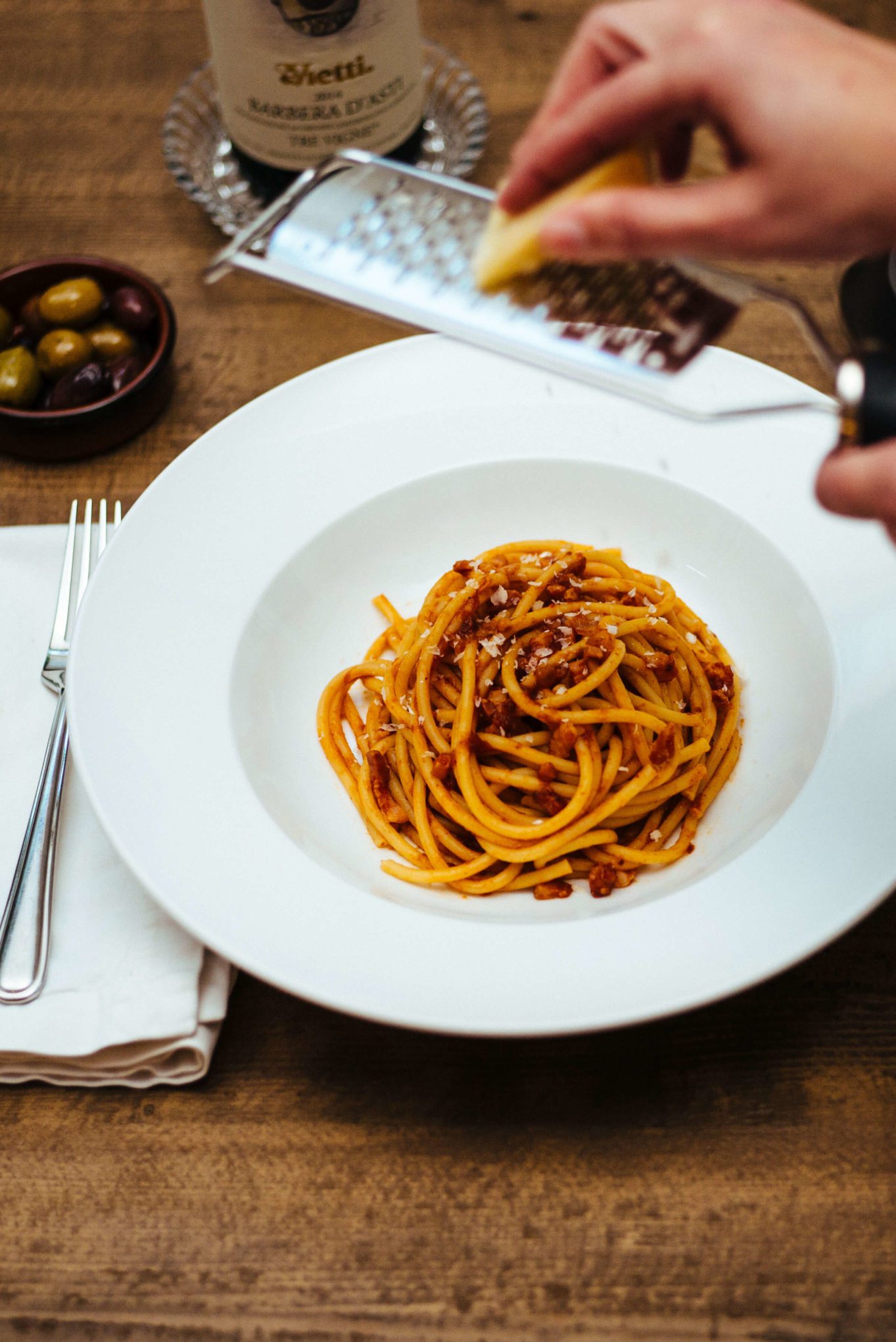 The Taste Edit tops pasta all'amatriciana with parmesan cheese