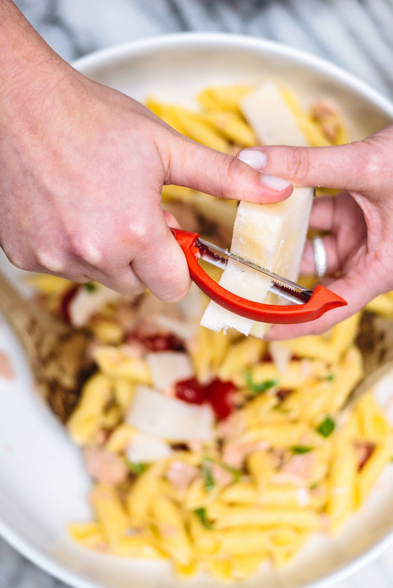 Top the pasta with tuna and cherry tomatoes with cheese