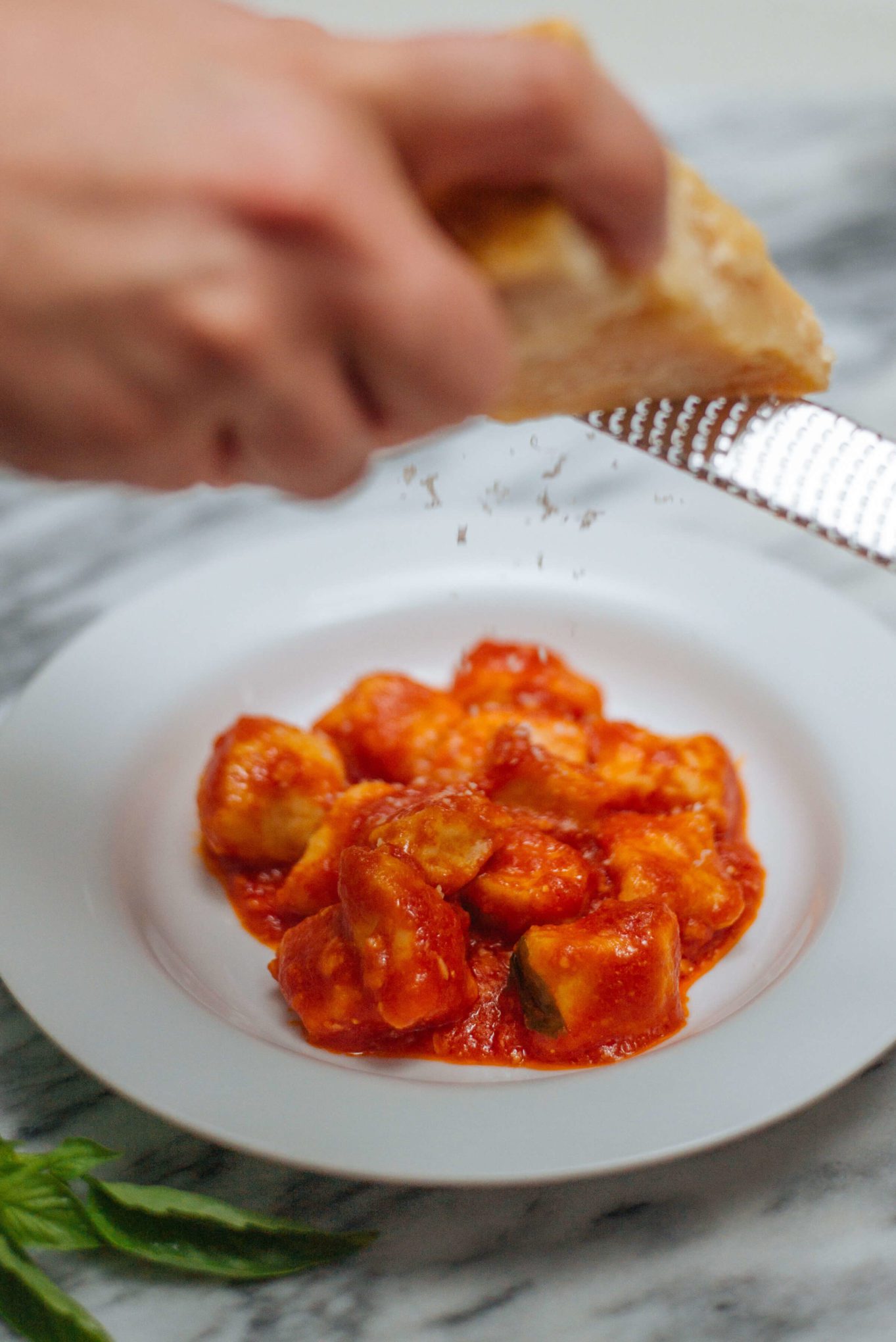 Topping ricotta gnocchi with grana padano