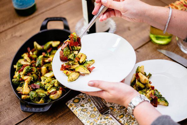 The Taste Edit makes their recipe of spicy italian brussel sprouts with prosciutto di parma