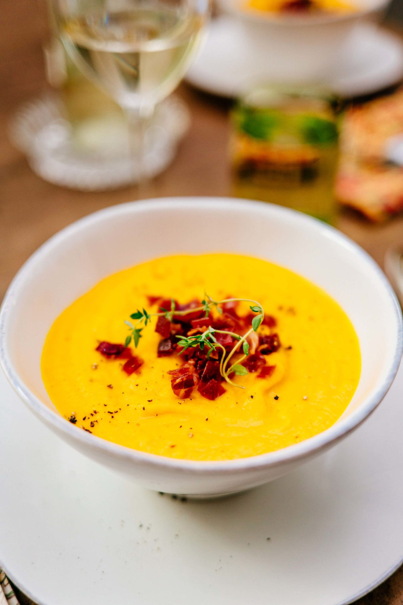 Roasted Kabocha Squash Soup is topped with with Crispy Prosciutto