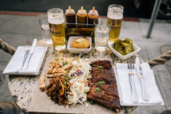 The Taste Edit visits Bounty Hunter Wine Bar & Smokin' BBQ in Napa who's bbq platter and beer is the best in napa with a side of corn bread and brick chicken