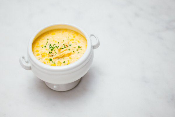 The Taste Edit's recipe for the best crab and corn chowder served in a Crate and Barrel footed bowl