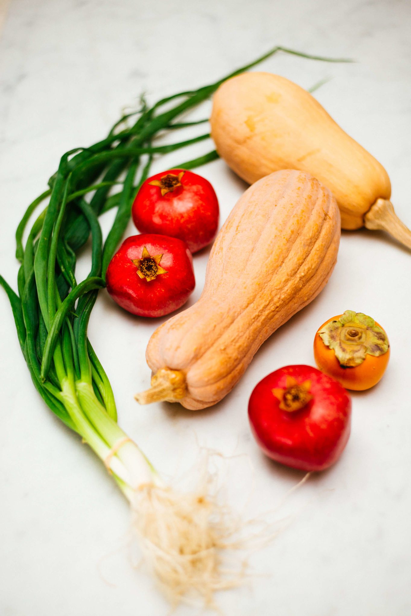 Farmers market hall from CUESA with italian squash, pomegranate, persimmon, and green onions