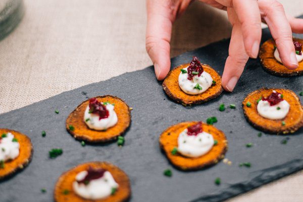 Thanksgiving or Friendsgiving sweet potato bites with Creme Fraiche and cranberries