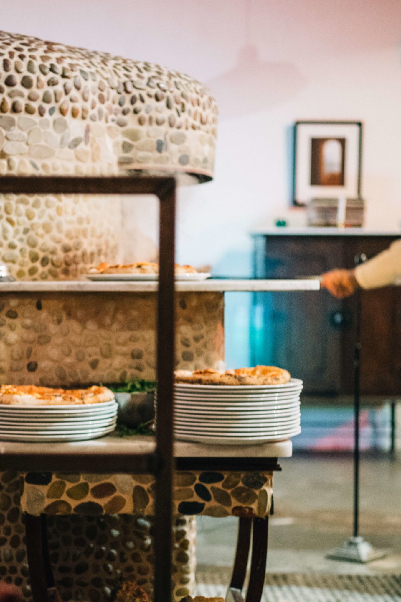 Anthony Mangieri putting Neapolitan Pizza into the oven at Una Pizza Napoletana in in San Francisco with The Taste Edit