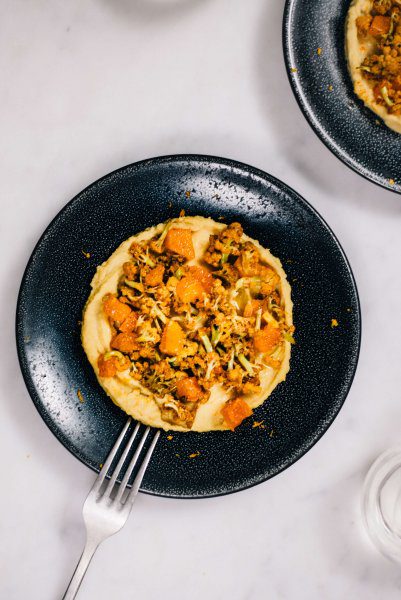 Roasted Harissa Cauliflower on a bed of homemade hummus recipe