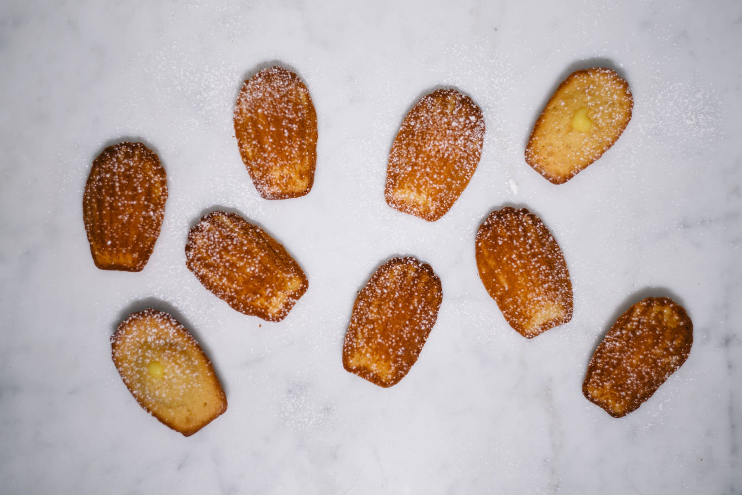 Meyer Lemon Curd filled Madeleines are perfect for tea or dessert made by The Taste Edit