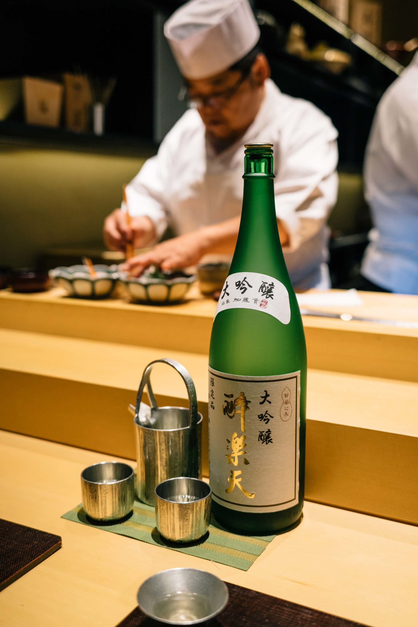 Saki is served in puter glasses at San Francisco's Omakase restaurant, The Taste Edit