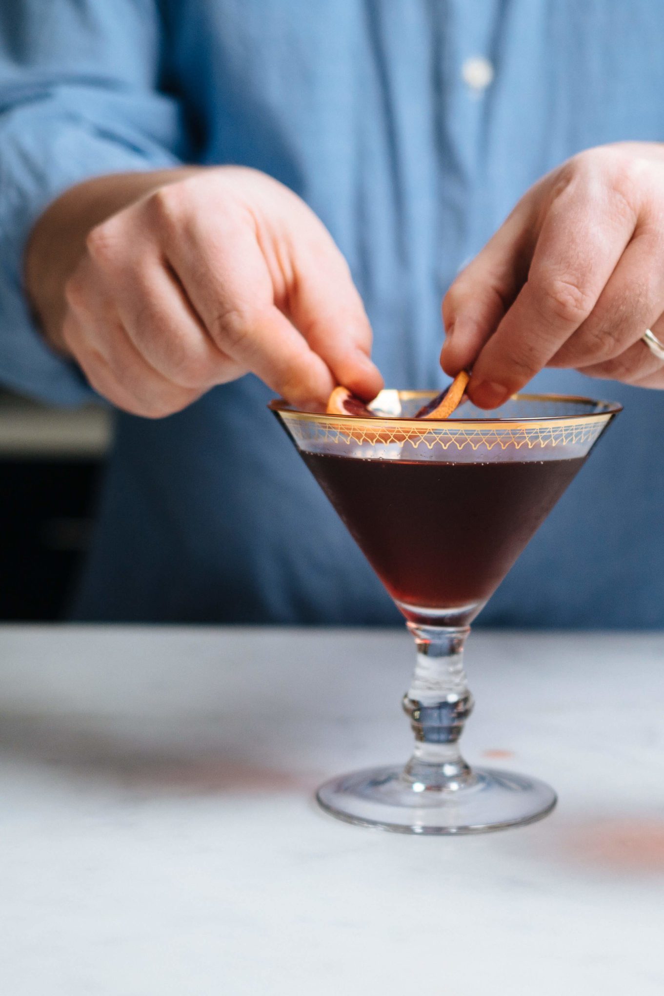 Garnish a boulevardier cocktail with a slice of blood orange, made by The Taste Edit