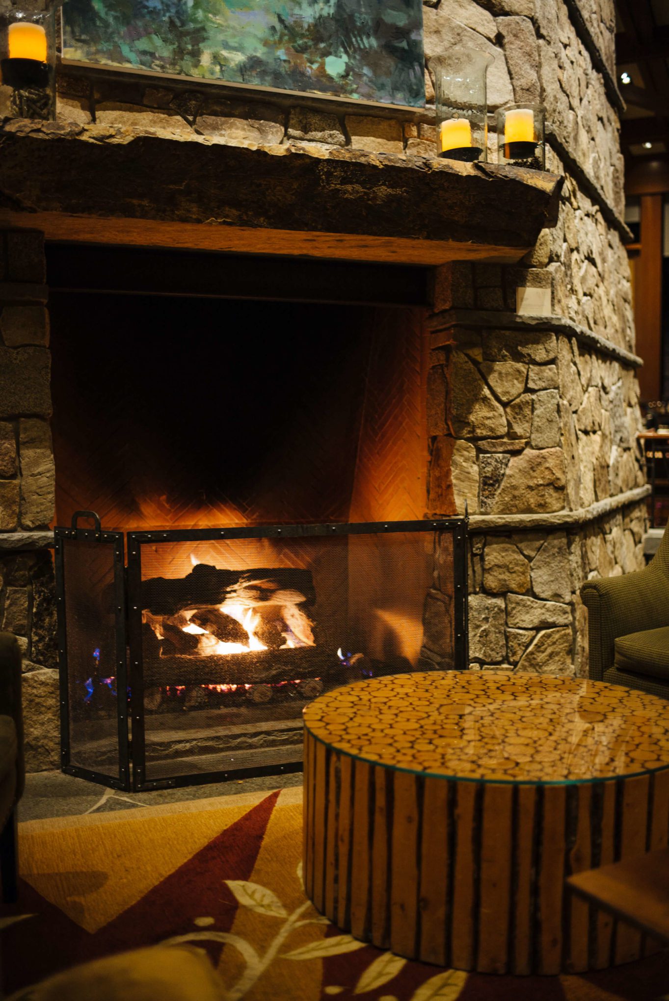 The great fireplace at The Ritz-Carlton Lake Tahoe is perfect to sip cocktails or a hot beverage in front of any time of day says The Taste Edit