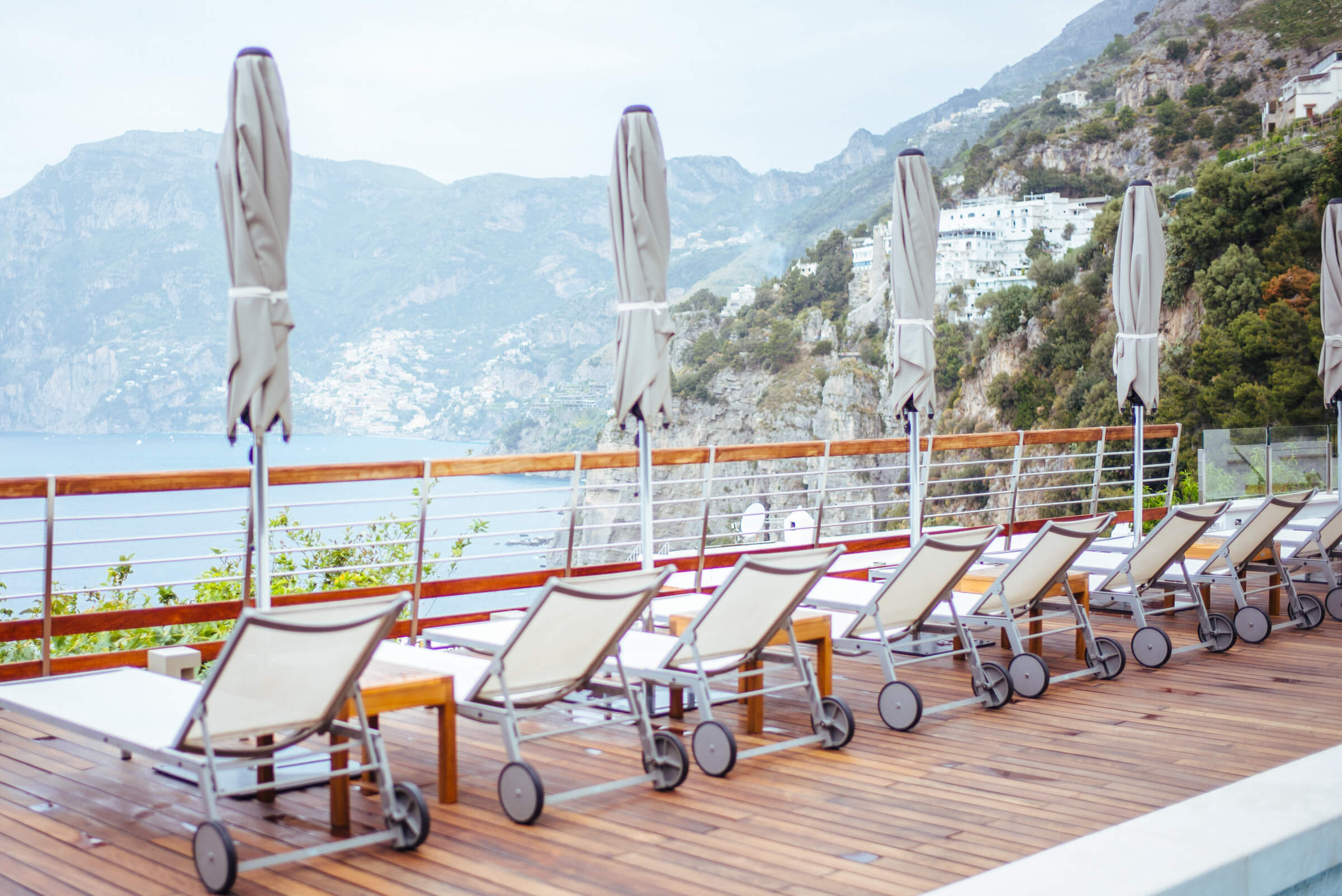 lounge chairs overlooking Positano at Casa Angelina Lifestyle Hotel in Praiano Italy, The Taste Edit