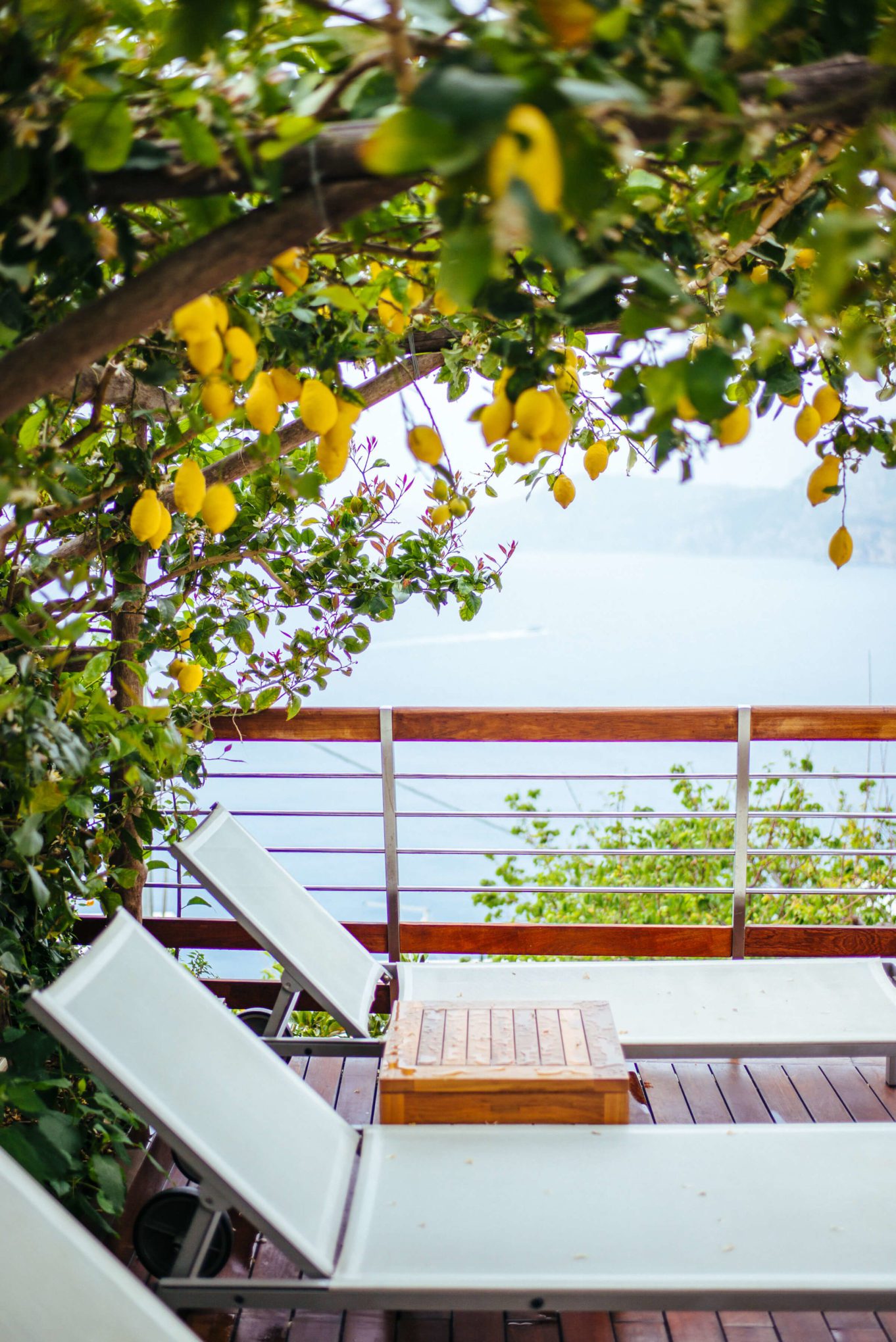 Relaxing lounge chairs by the pool at the hotel on the amalfi coast Casa Angelina Lifestyle Hotel in Praiano Italy, The Taste Edit