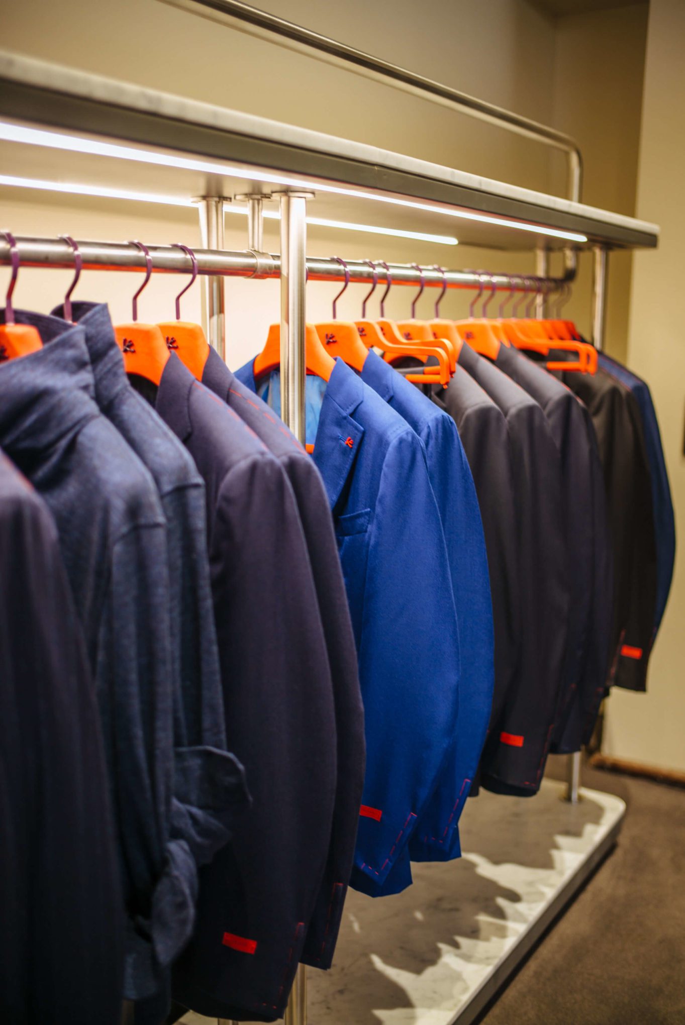 Suits with red hangers at Isaia San Francisco Store, Neapolitan Isaia suits in the historic VC Morris Frank Lloyd Wright San Francisco, The Taste Edit