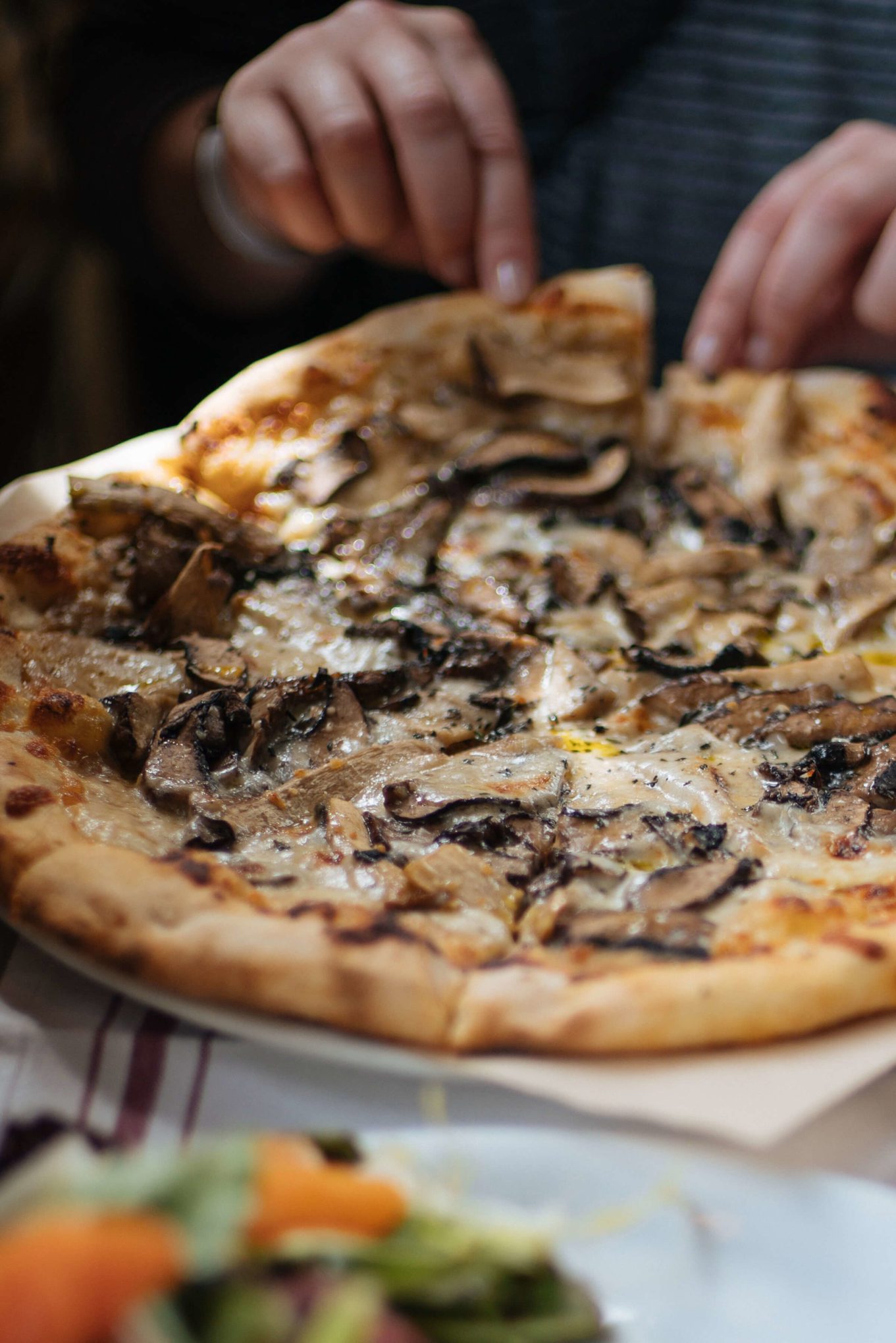 Stop at La Bicyclette in Carmel By The Sea, try the wood fired pizza Champignons, made with portobello and oyster mushrooms, mozzarella, thyme, caramelized onion and truffle, thetasteedit