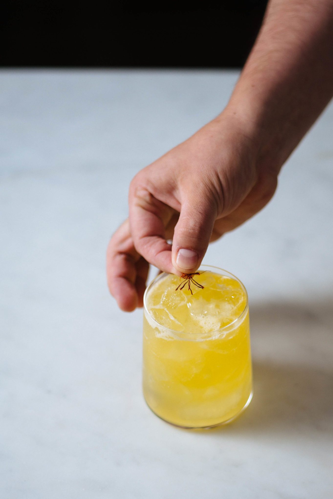 Topping the Linch Pin cocktail with Saffron by The Taste Edit