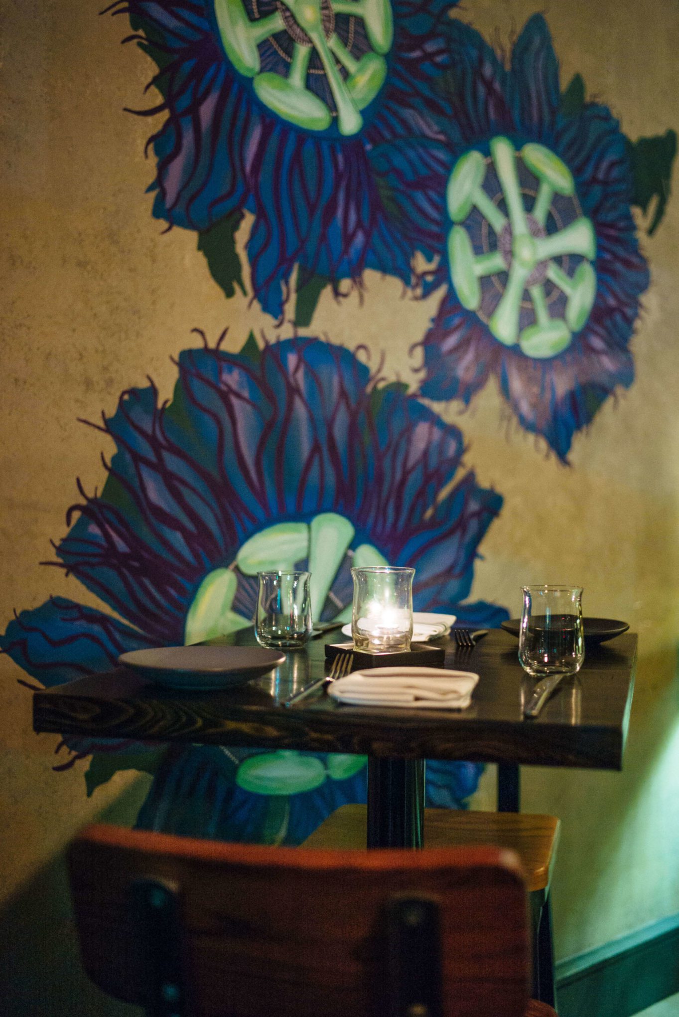 Tables with flower murals at Maypop Restaurant in New Orleans, The Taste Edit