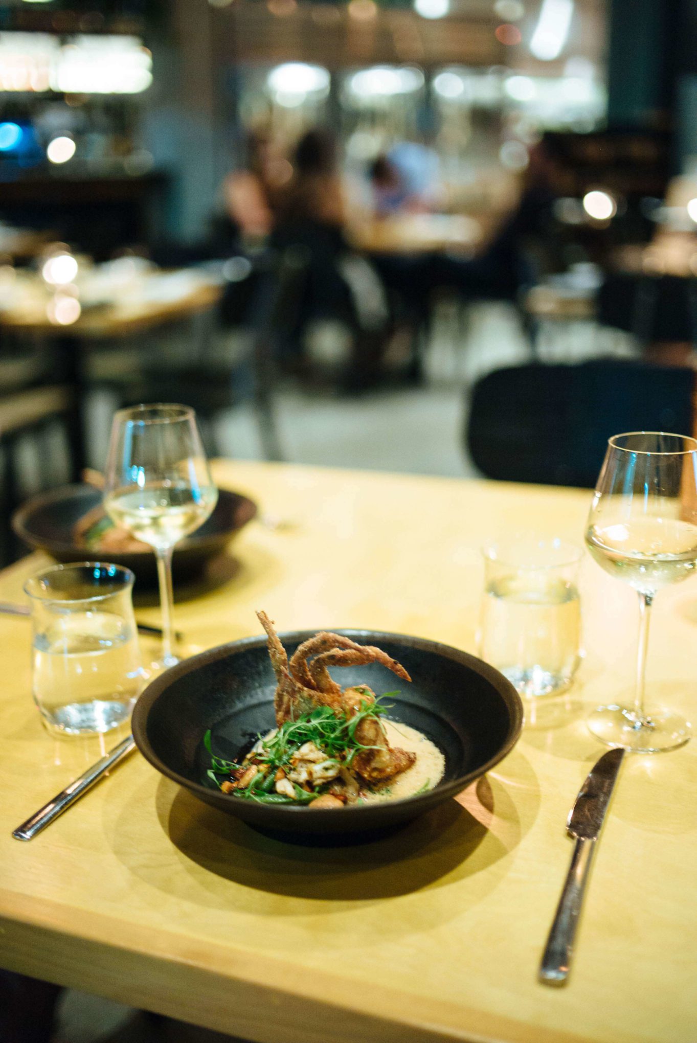 Softshell Crab Amandine $35 brown butter, blue crab, and shaved bean salad, marcona almonds, coconut lime leaf meunière at the best restaurant in new orleans, Maypop Restaurant in NOLA, The Taste Edit