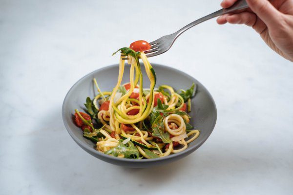 Make zucchini noodles with a fresh tomato sauce for a healthy recipe alternative to pasta by The Taste Edit