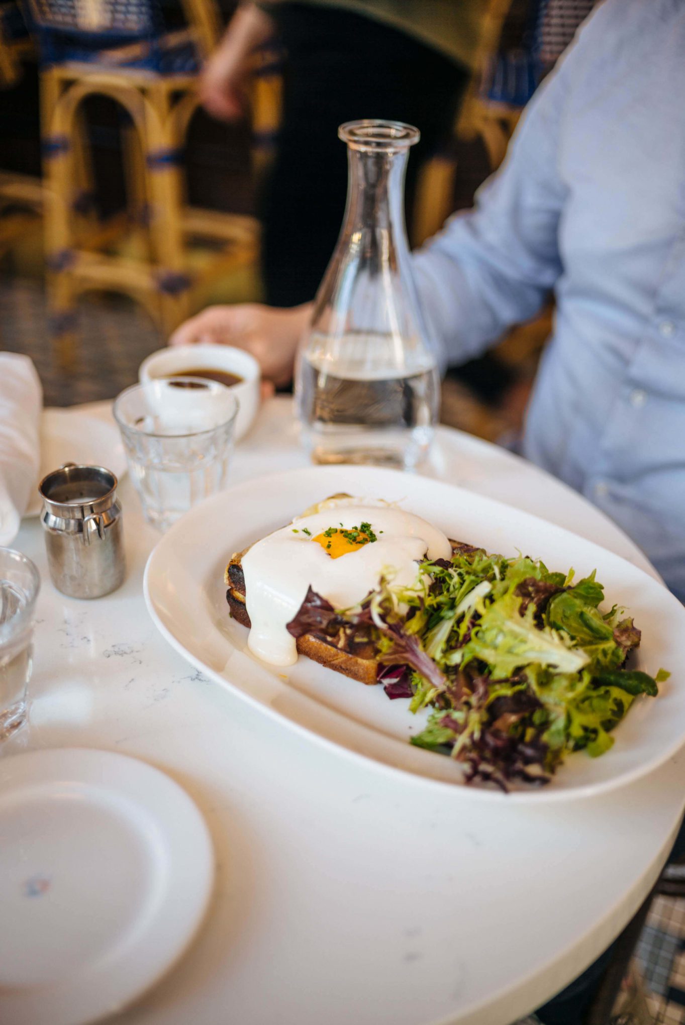 Ordering a Croque Madame Le Politique in Austin, TX.