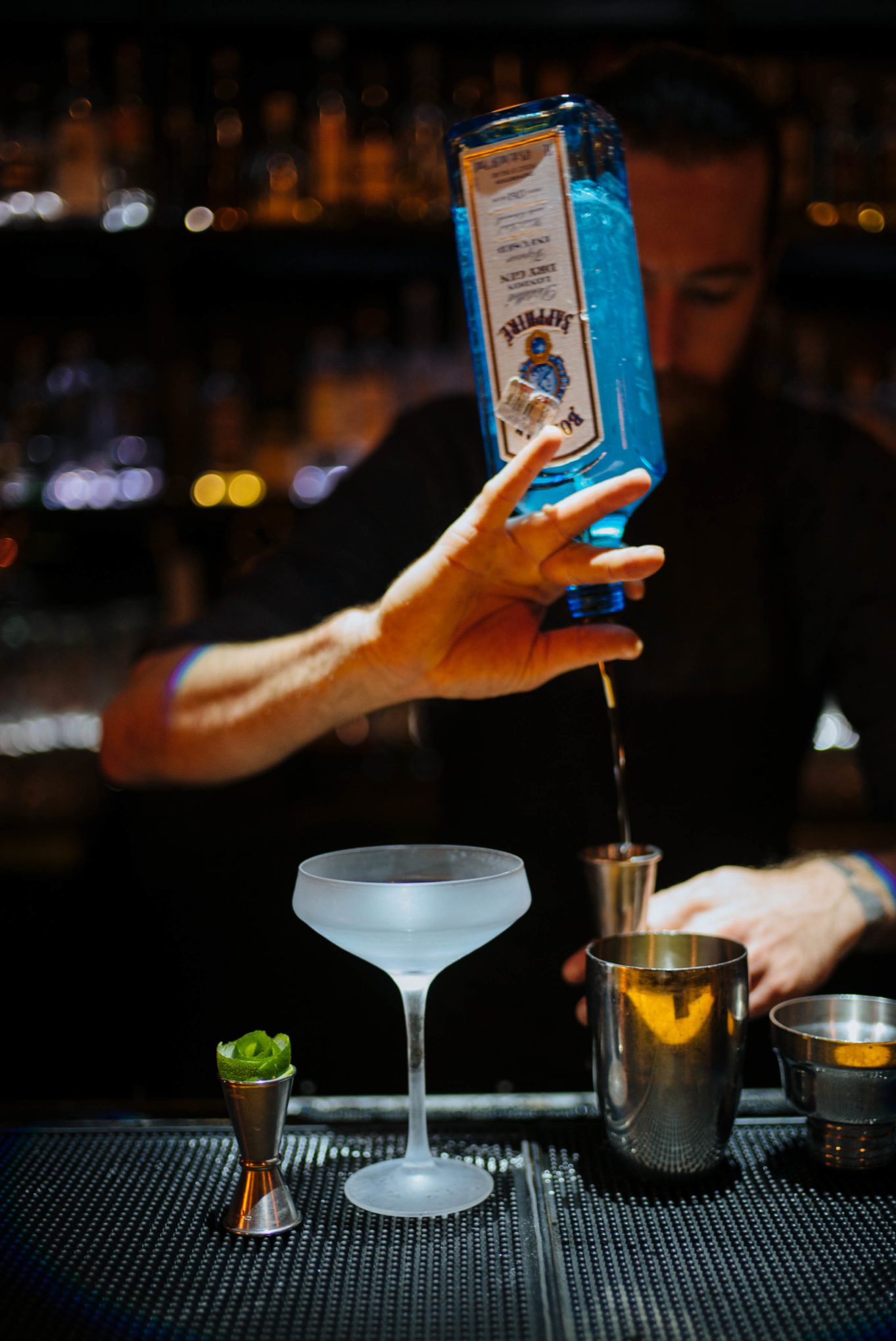 Mixing craft cocktails with gin at The Roosevelt Room in Austin find the best Austin restaurants here