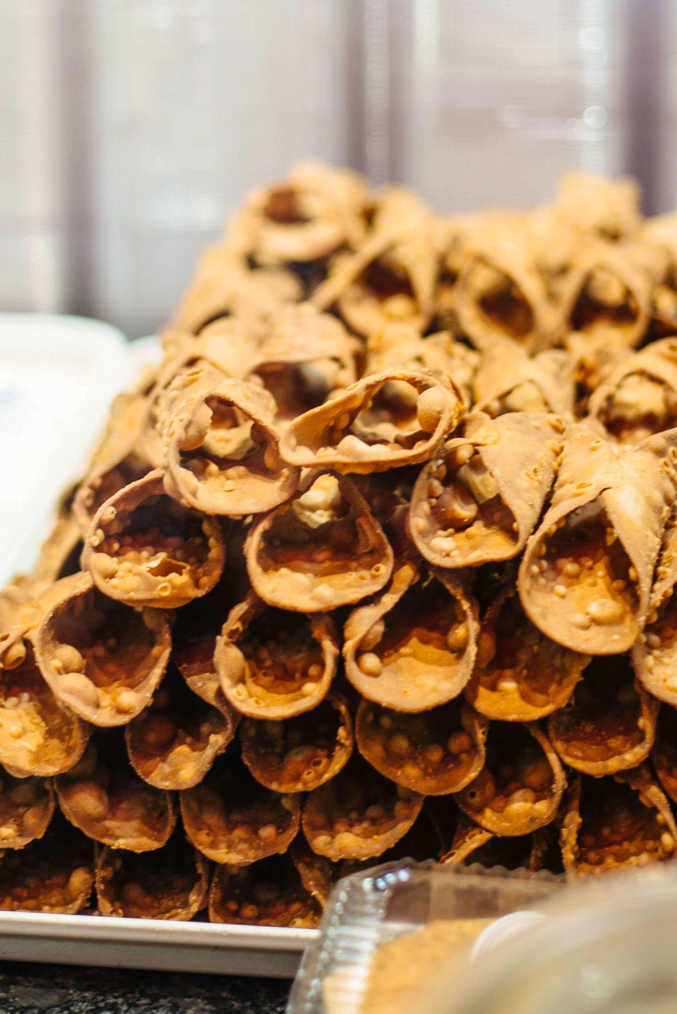 Get a Cannoli at Termini Brothers in Reading Terminal Market. Visit Philadelphia for some of the best food and historical sites. You must visit the Termini Brothers for some of the best Italian pastries like cannoli and cakes #thetasteedit #travel #philadelphia #market