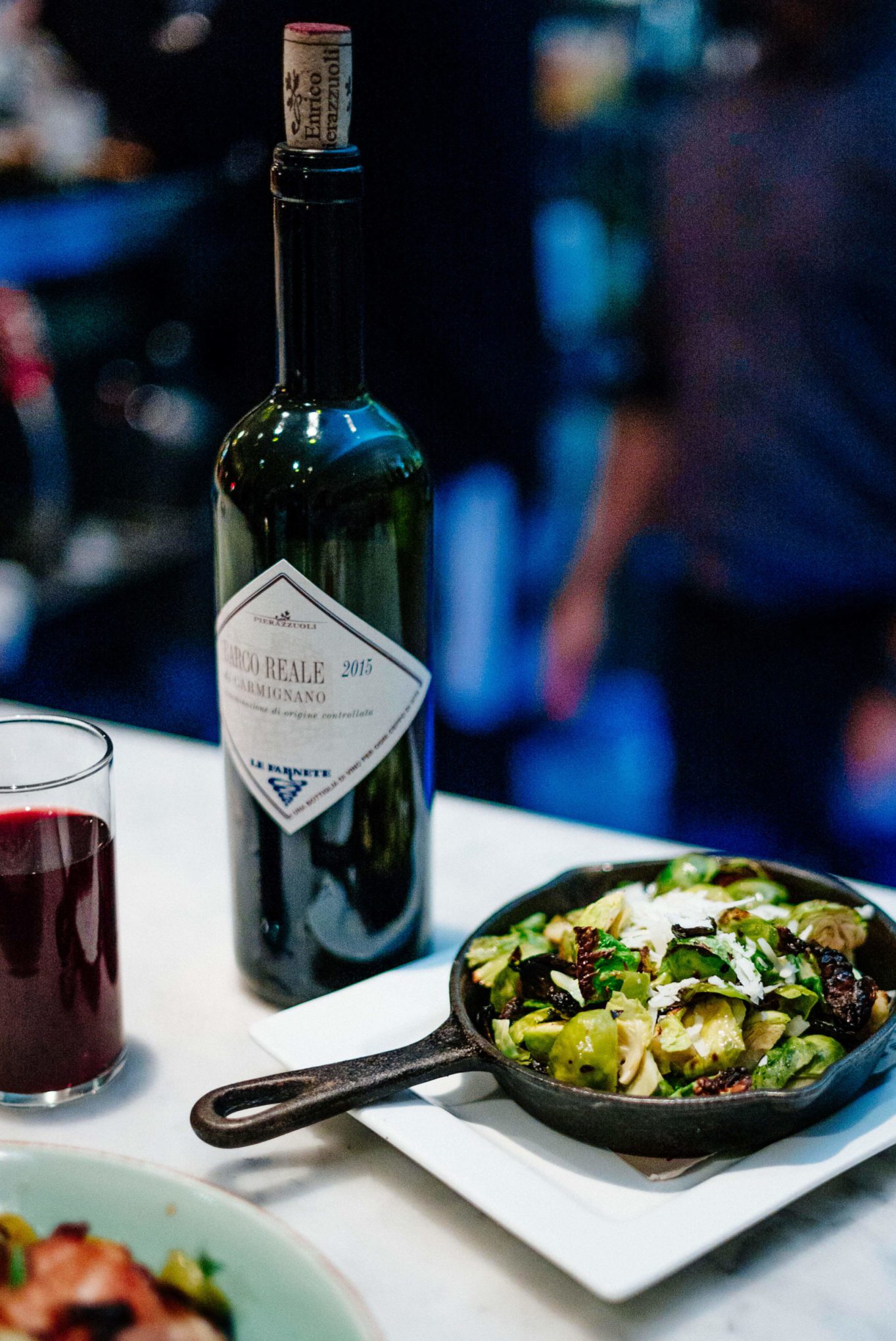 Visit Birba in Palm Springs- try cacio e pepe brussels sprouts made with parmesan cheese and the roasted chicken , The Taste Edit