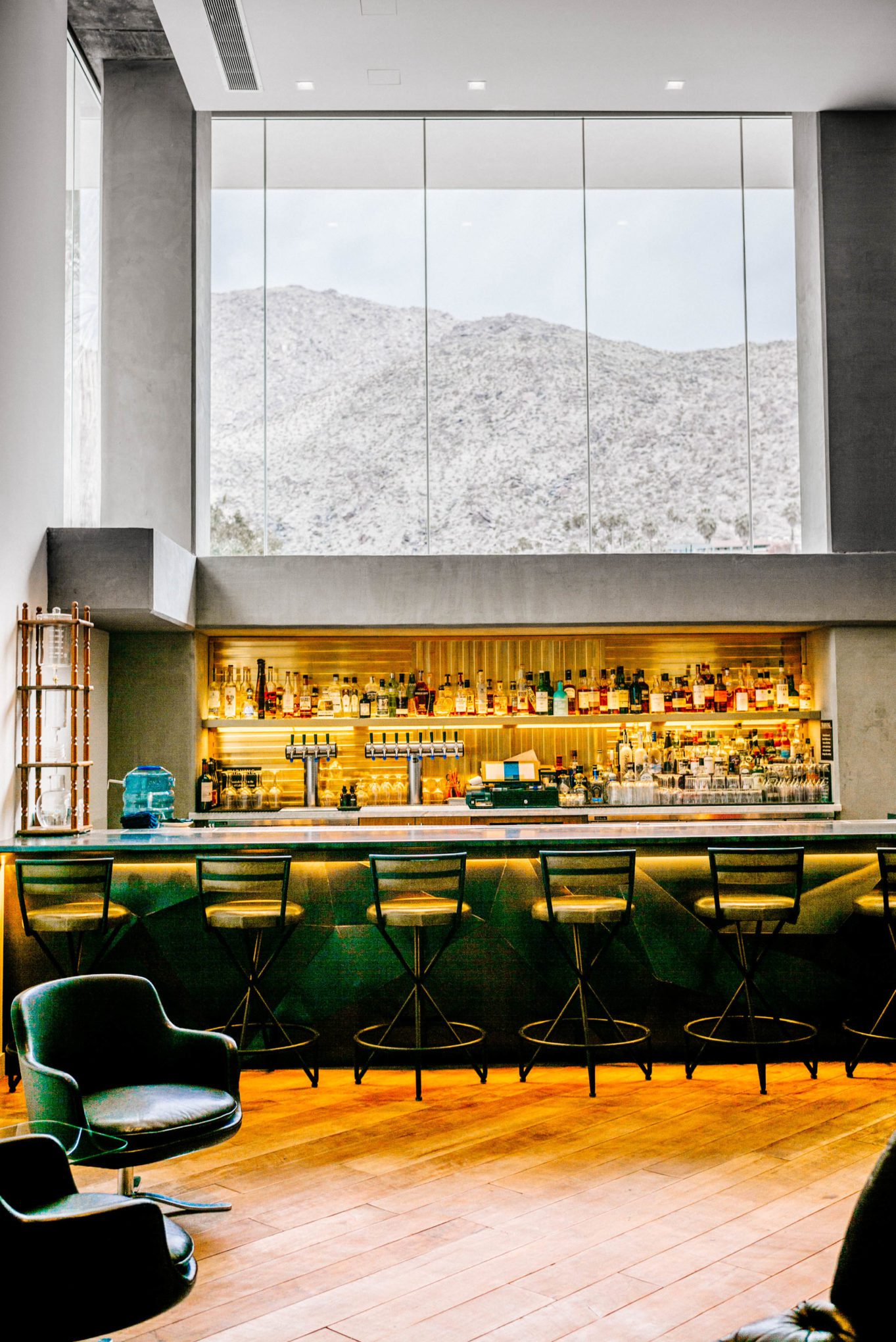 When you stay at the Kimpton Rowan Hotel in Palm Springs there's a fantastic bar with a view and wine happy hour, it's a dessert retreat, is clean, and modern, The Taste Edit