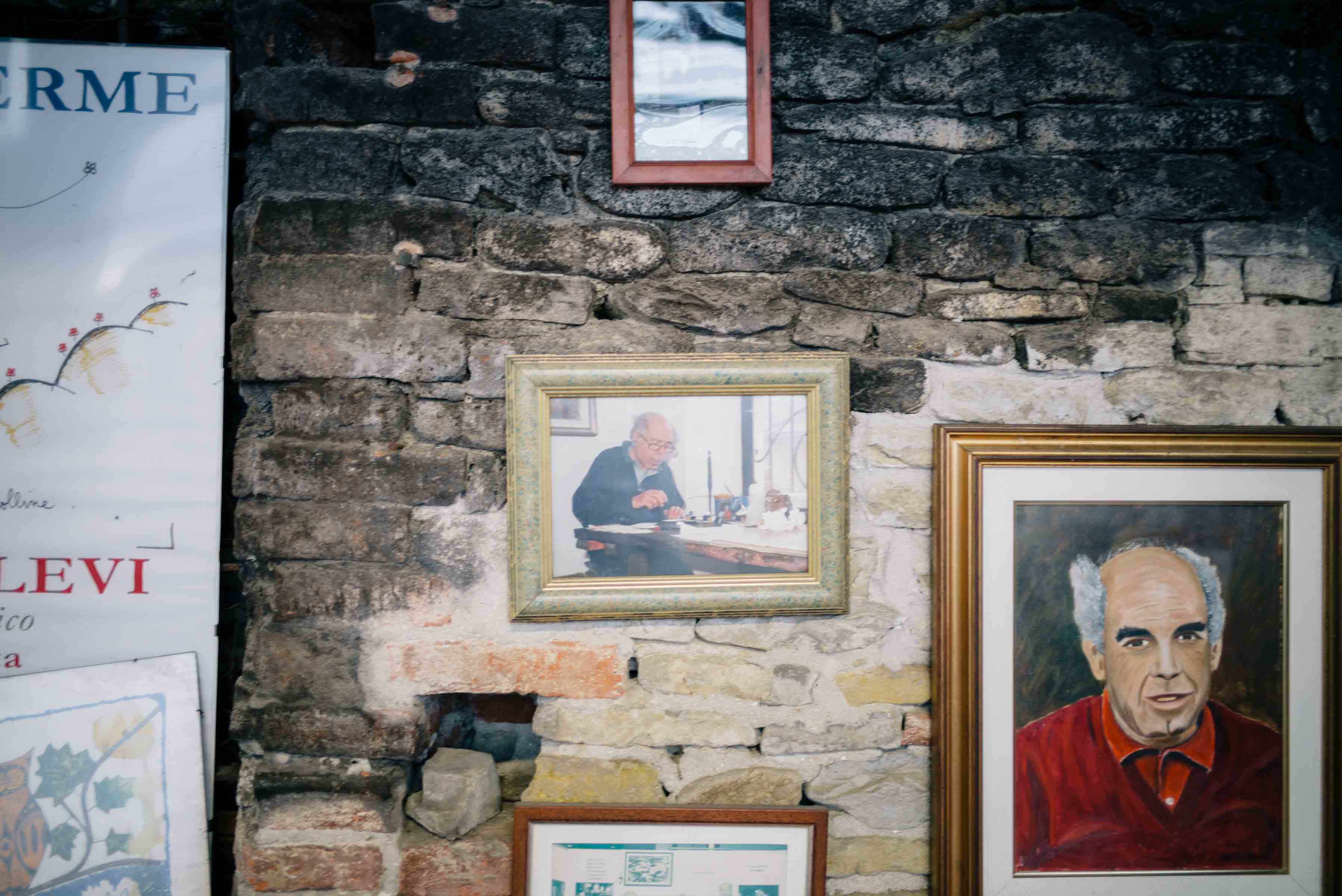 Photos and paintings of Romano are on display at the distillery. The Taste Edit visiting Romano Levi Grappa distillery in Piedmont, Italy.