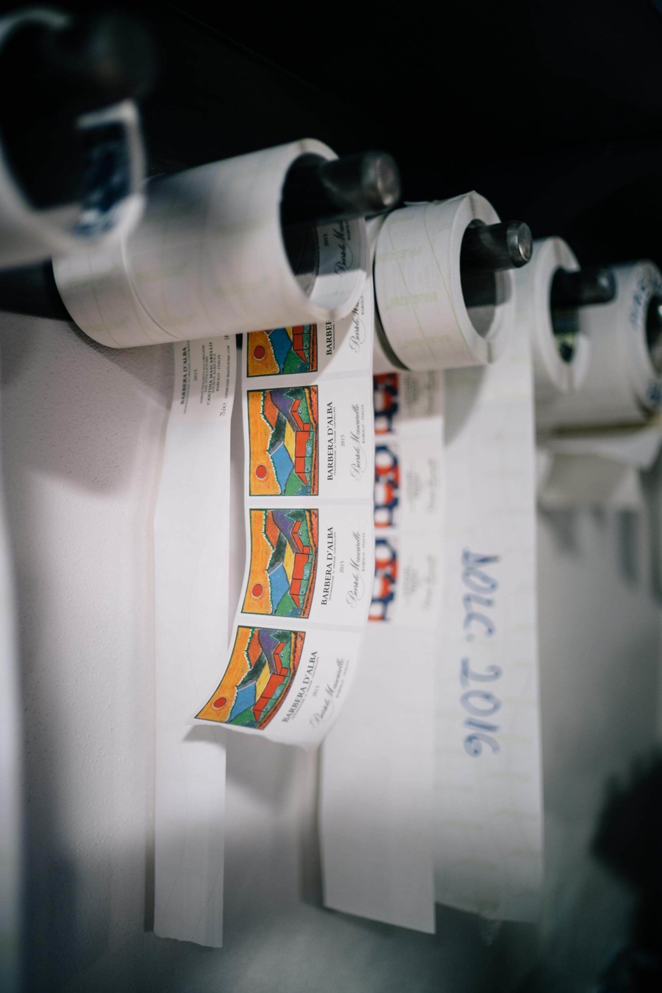 Rolls of labels at legendary winery Bartolo Mascarello in Piedmont, one of the best wineries in piedmont, see The Taste Edit’s visit.