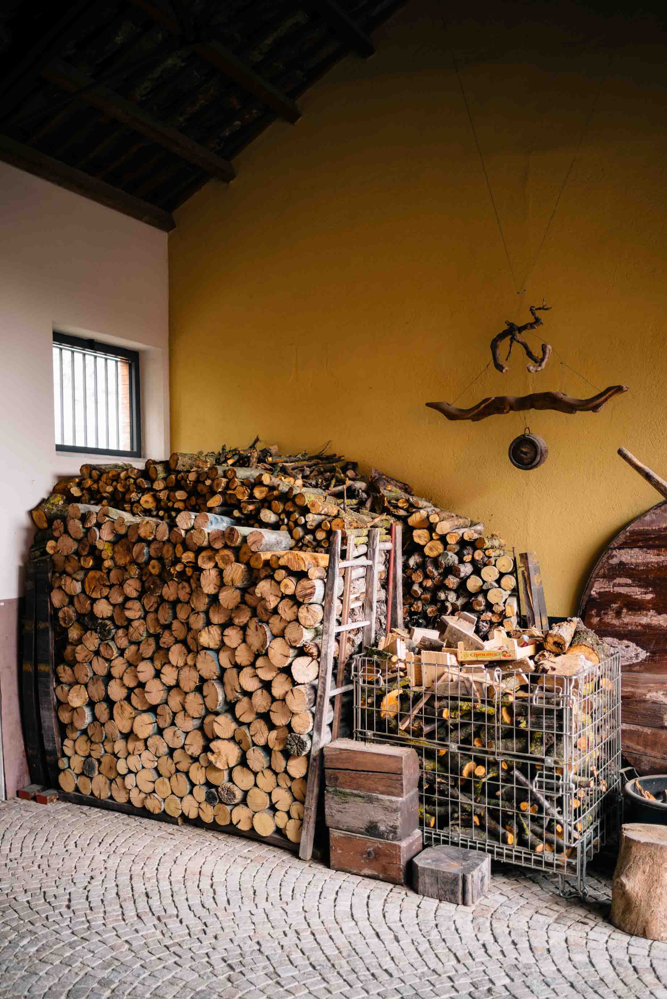 Firewood at legendary winery Bartolo Mascarello in Piedmont, one of the best wineries in piedmont, see The Taste Edit’s visit.