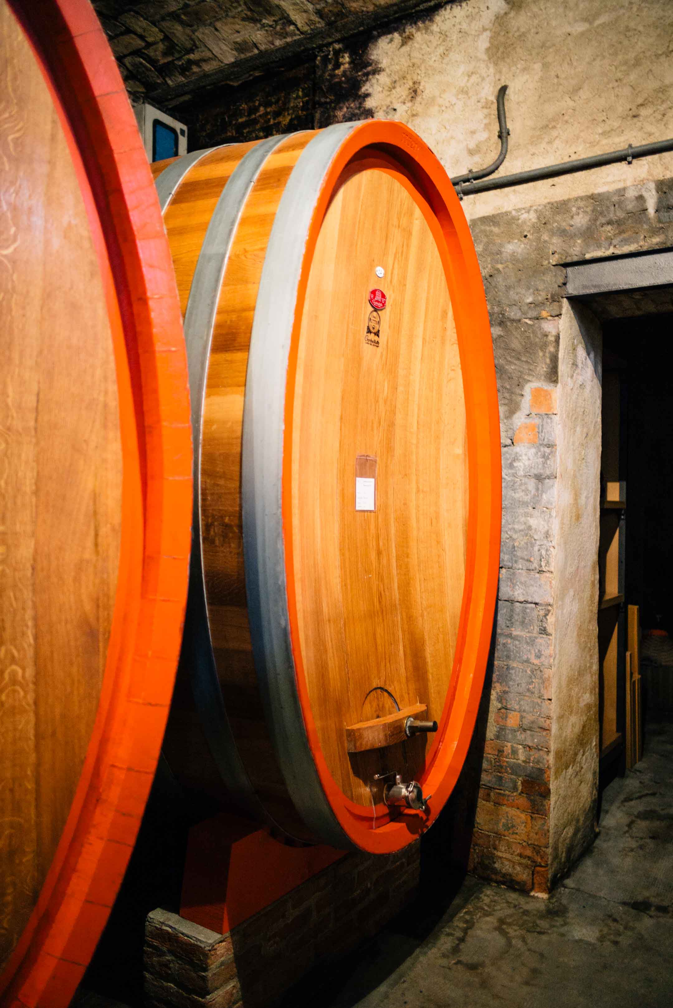 Wine barrels at legendary winery Bartolo Mascarello in Piedmont, one of the best wineries in piedmont, see The Taste Edit’s visit.