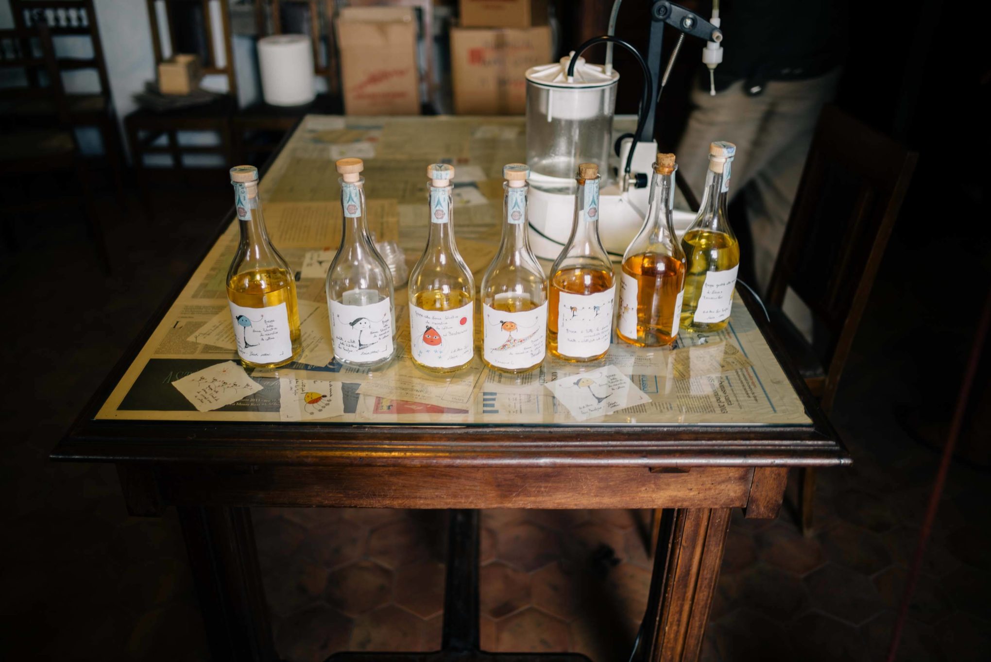 Bottles of grappa to taste at the distillery. The Taste Edit visiting Romano Levi Grappa distillery in Piedmont, Italy.